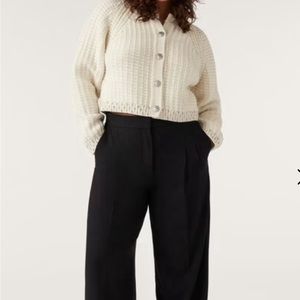 Designer sweater with Swarovski crystals. Can be worn two ways.